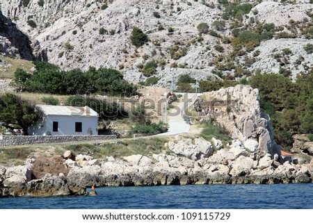 Road and houses on the sea coast near Bashka, Krk island, Croatia