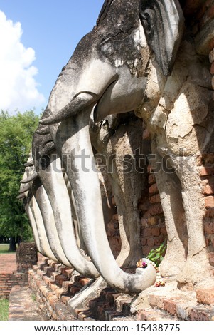 White elephants and brick pagoda in old Sukhotai, Thailand