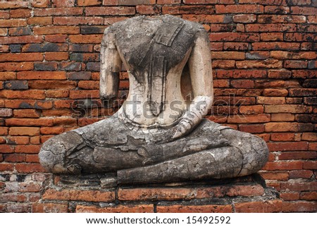 Buddha without head and red brick all in Ayuthaya, Thailand