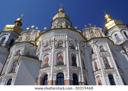 White church with golden domes in Lavramonastery