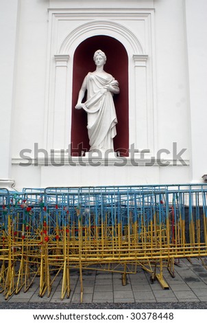 White statue on the facade on building ion Odessa, Ukraine