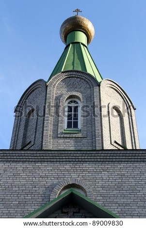 Onion shape cupola and green roof of new russian church in Murmansk, Russia