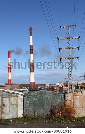 Chimneys, electric wire and garages in Murmansk, Russia