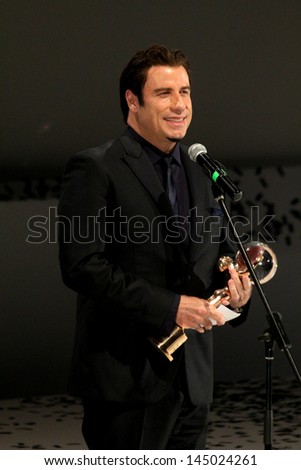 KARLOVY VARY, JUNE 28: John Travolta top Hollywood stars pick up a Crystal Globe lifetime achievement award at Friday\'s opening of the film festival, Karlovy Vary on June 28, 2013, Czech Republic
