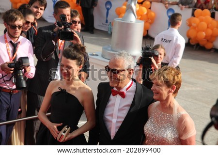 KARLOVY VARY, CZECH REPUBLIC  JULY 4, 2014: Members of the Grand Jury Mira Fornay, Luis Minarro and his wife (L-R) arrived to at the International Film Festival, Karlovy Vary