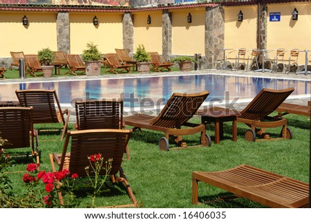 spa pool with nice wooden rocking chairs
