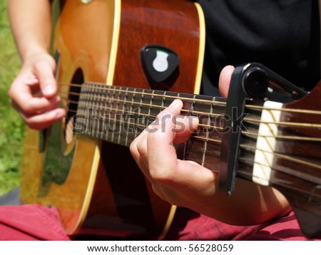 close up with guitar played outdoor