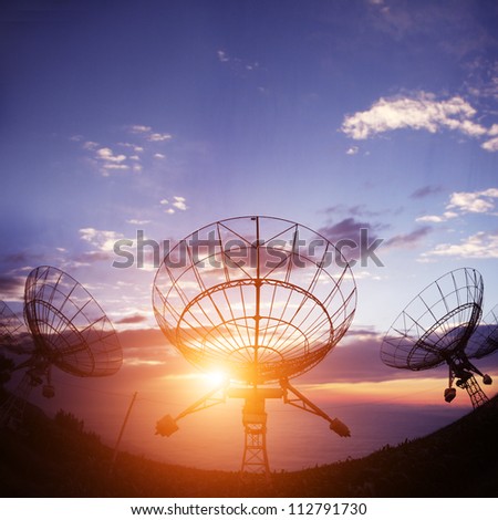 satellite dishes antenna with sunset