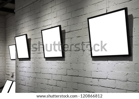 frames on white wall in art museum