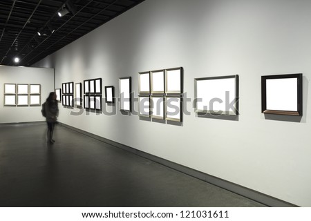 frames on white wall in art museum