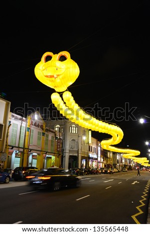 SINGAPORE - Mar 5: Yellow lanterns garland hanged over South Bridge Road just before Chinese New Year Celebration in Chinatown district of Singapore on Mar 5, 2013 in Singapore.