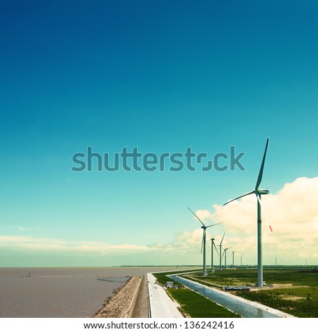 Wind turbines in the field generating electricity