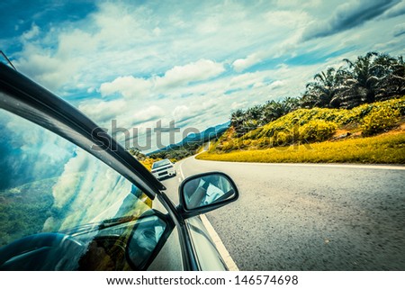 speed car driving at high speed on empty road - motion blur