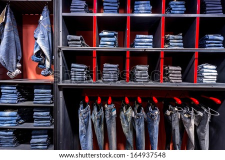 Jeans shirts at shelf in shop