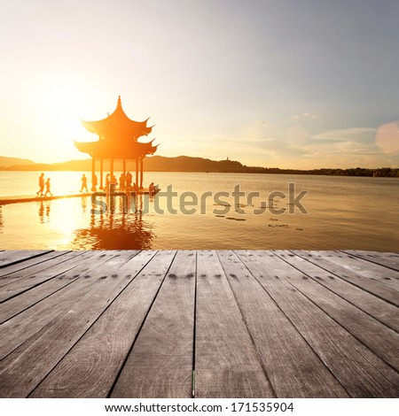 ancient pavilion in hangzhou with sunset glow