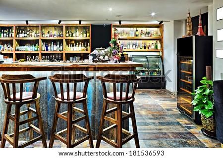 bar counter with chairs in empty comfortable restaurant