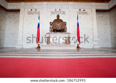 TAIPEI, TAIWAN-March 16: The large bronze statue of Chiang Kai-shek on March 16,2014 in Taipei, Taiwan. This bronze statue dominates the main hall of the CKS memorial hall.