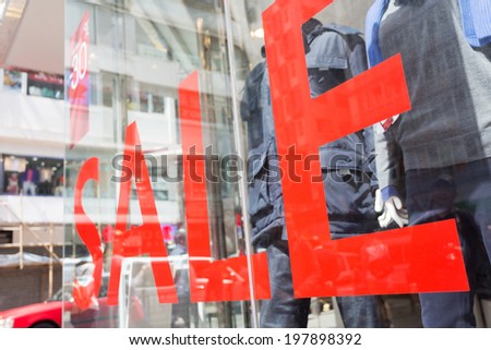 Sale Sign In A Clothing Store Window