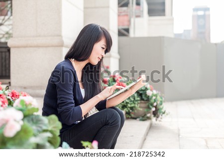 young asian woman with laptop