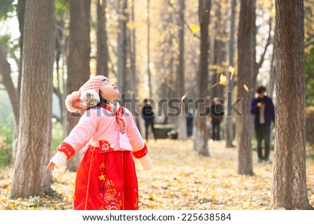 little girl dress new year  costume and enjoy outdoor  in forest
