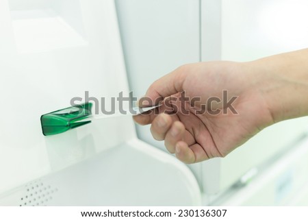 hand out the digital card to scan in device