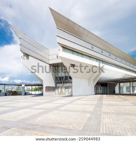 kallang,Singapore-July 1,2014: panoramic skyline and singapore indoor stadium exterior.Singapore Indoor Stadium is an indoor sports arena, located in Kallang,