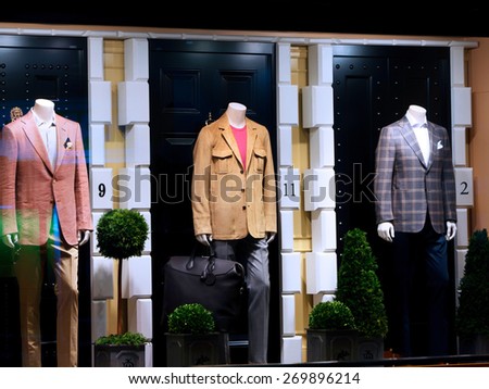 Fashion shop display window with mannequins