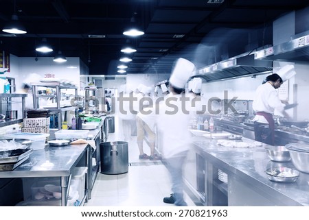 modern hotel kitchen and busy chefs.