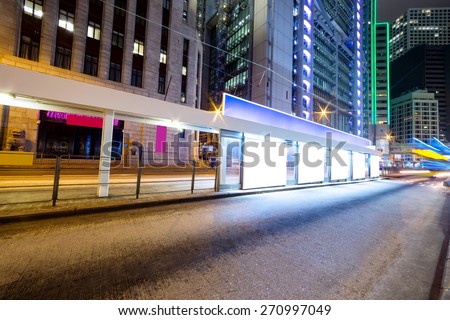 traffic light trails nearby bus stop