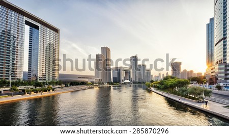modern skyscrapers and skyline during sunset at riverbank  in china urban city and downtown district