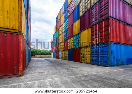 stack of containers with empty road in front