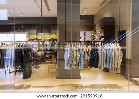 clothes on hanger in modern fashion shop