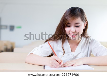 Asian beautiful female student study portrait in classroom