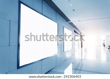 Empty blank billboard in shopping mall interior