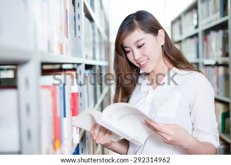 asian beautiful female student portrait in library