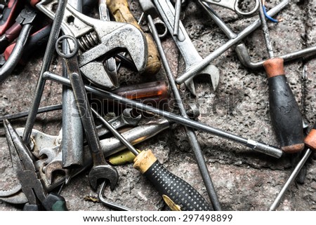 closeup view of work tools on brick ground