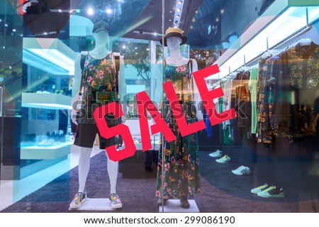 sale word on shopfront display window