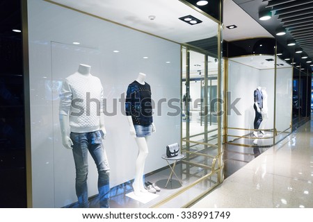 modern shopping mall interior, fashion shops in