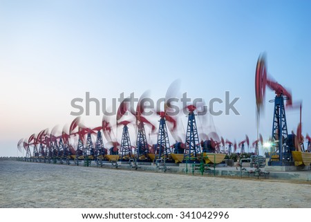 working oil-rig in oilfield in clear sky