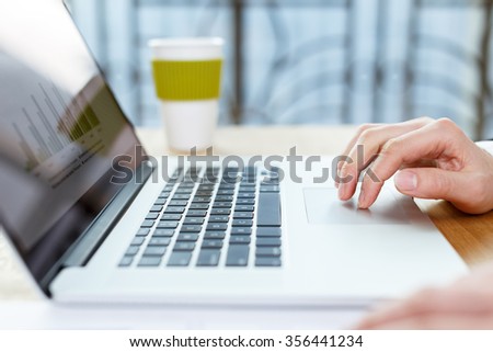 business man checking financial reports on table using computer,digital tablet and mobile phone