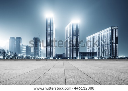 modern office buildings in hangzhou west lake square at night on view from empty street