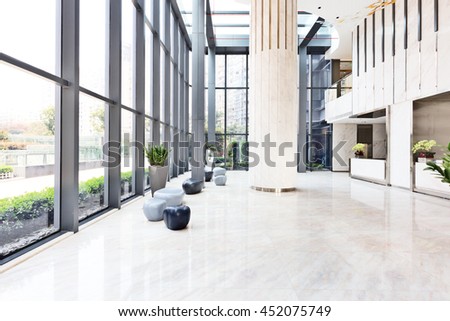 elegant stools and table in huge and bright hall
