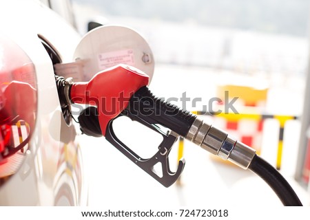 close up of gas gun with car