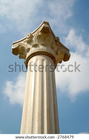 Top of white pillar against sky
