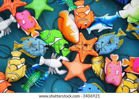 fish,crab and other toy in water