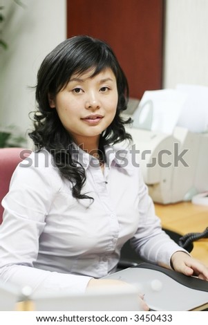 beautiful young business woman portrait in office