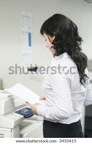 a young woman working with print in office