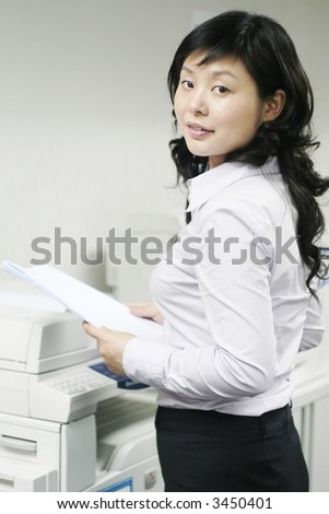 a young woman working with print  in office