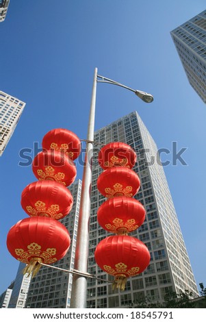 Red lantern and  skyscraper with blue sky in Beijing CBD(Central Business District),China. tradition   VS modern