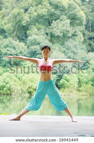 young chinese women doing yoga outside